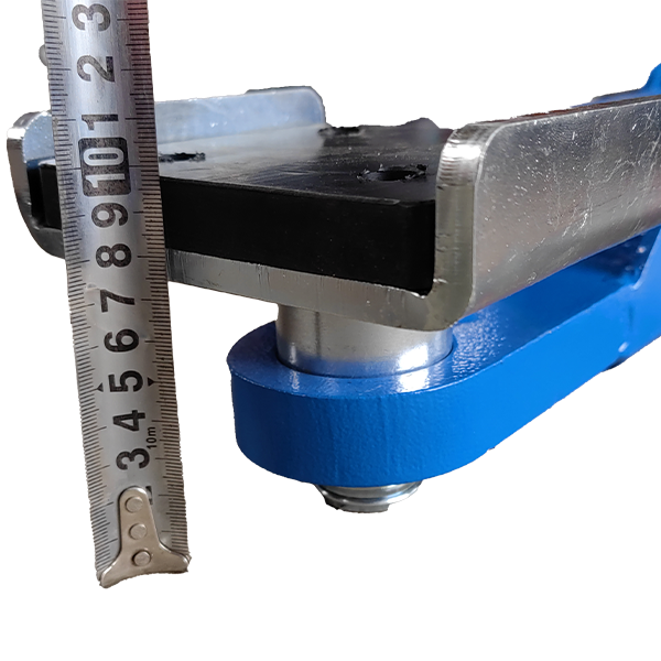 KT-MP5 frame cradle installed on a two-post vehicle lift arm beside a measuring ruler