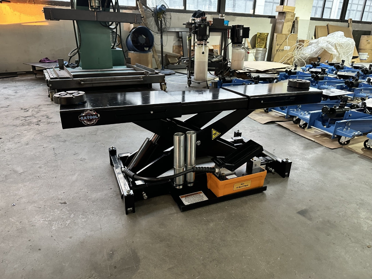 KATOOL KT-RJ70 air hydraulic rolling bridge jack side view in workshop
